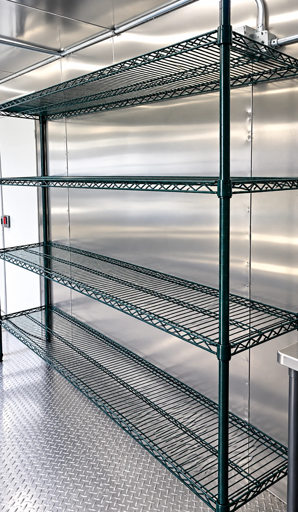 Commercial wire storage shelving inside a 38 ft low-temperature dishwashing trailer